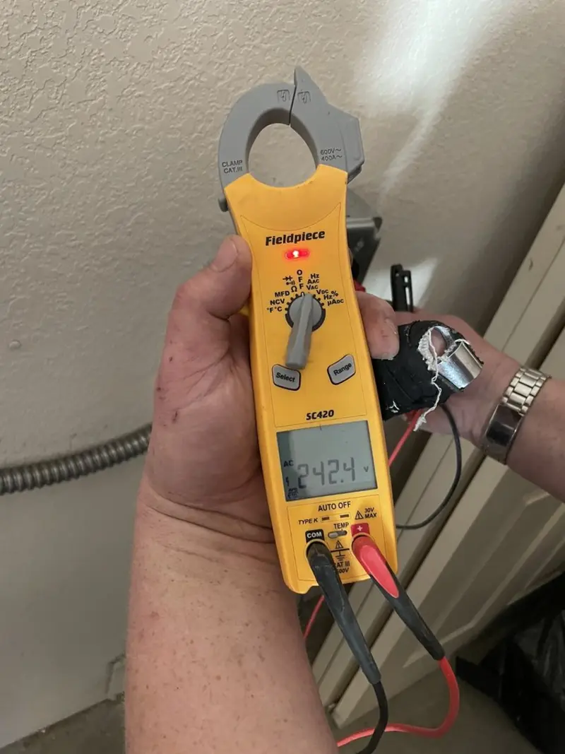 Voltage testing with clamp meter during Outlet Installation in New Franklin